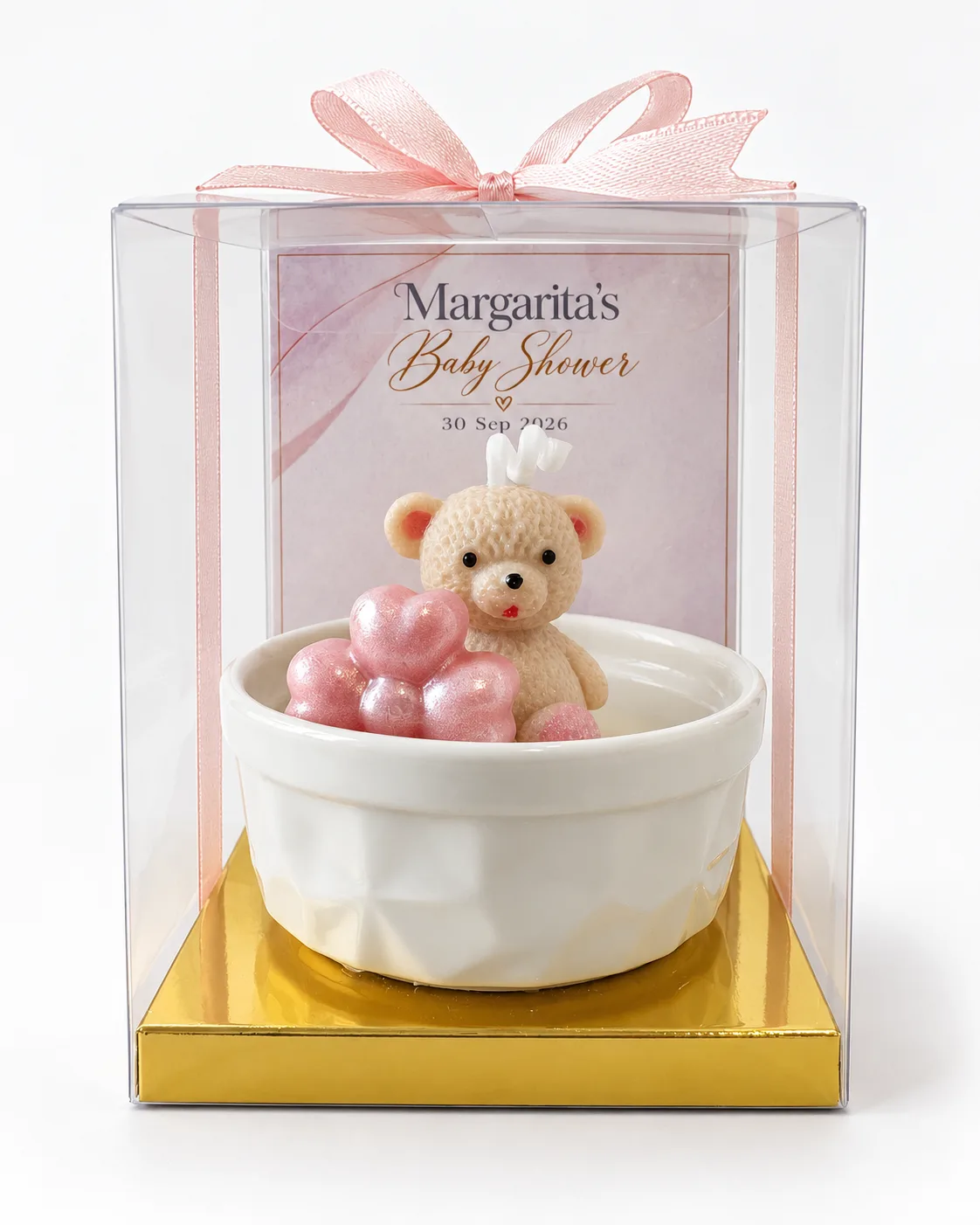 Recordatorio de baby shower personalizado en tonos rosa, con nombre y fecha.